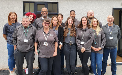 A photo of Uneek Learning's teamof employees outside the Hinckley school.